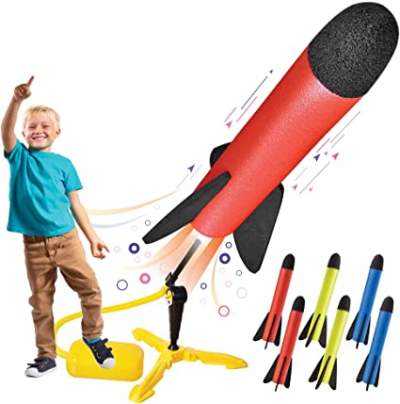 The boy launches toy rocket from Toy Rocket Launcher for kids